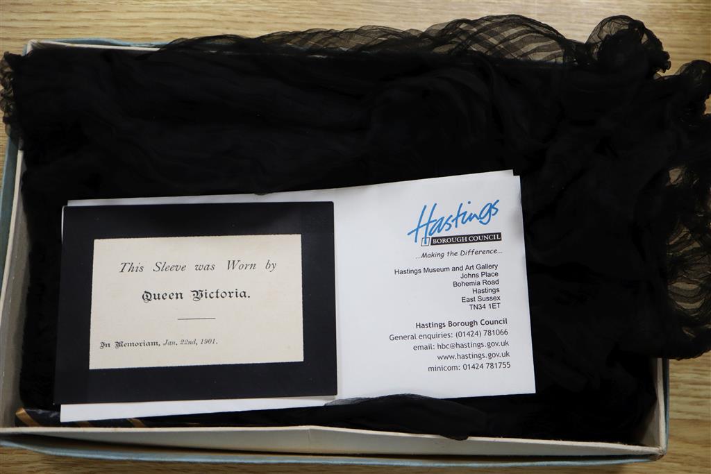 Queen Victoria interest: A black silk sleeve. Provenance, Vendors relation was in service to Queen Victoria